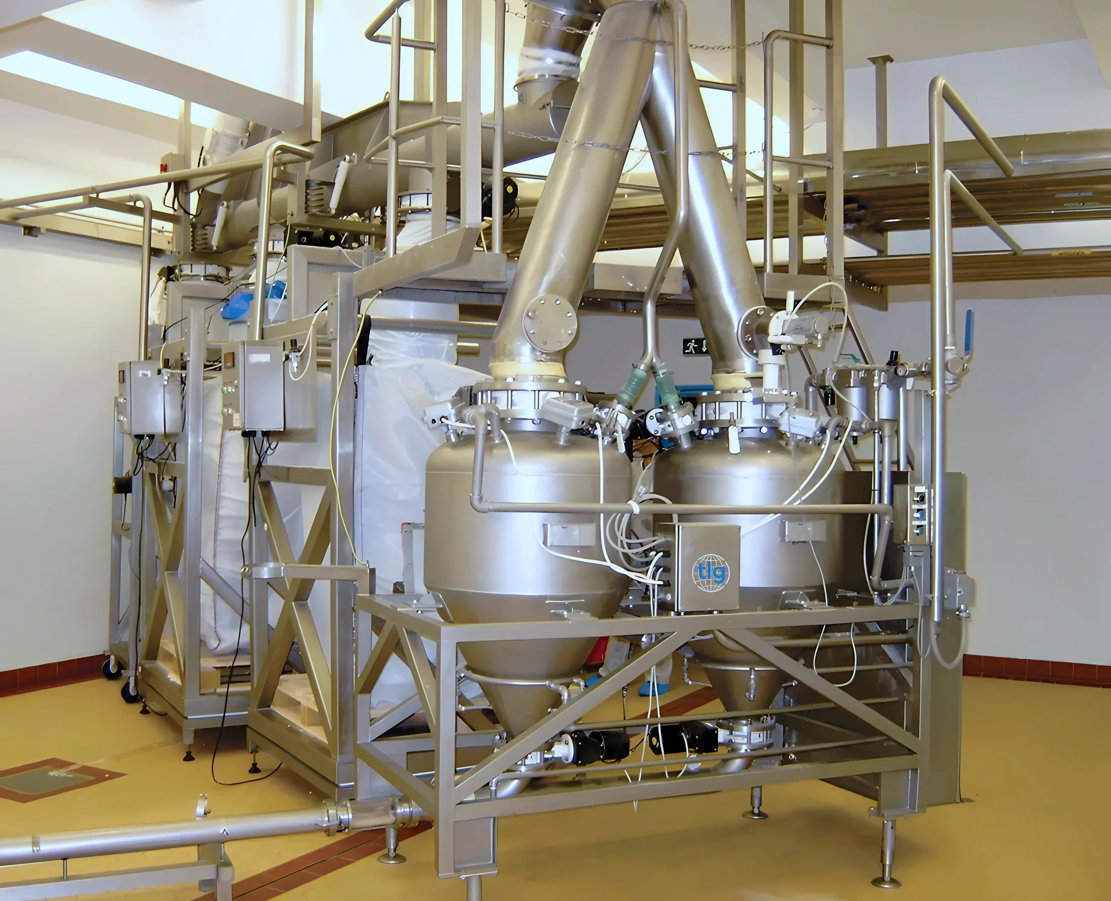 Twin TLG dense-phase pressure pots on a skid, installed and running